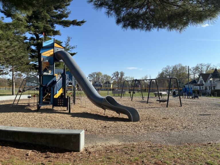 Joe Williams playground features a seat wall along the path around the play area