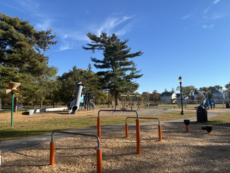 Joe Williams field and playground amenities viewed from the park bench in the fitness area