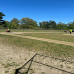 Joe Williams Field parks crew grooming the infield and pitcher's mound