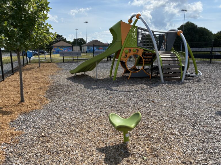 JT Owens Park features Ed Hooks Playground with separate play structure with slide and spinner for ages 2-5