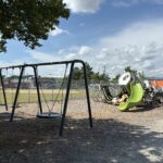 JT Owens Park features Ed Hooks playground with Swings for ages 2-12