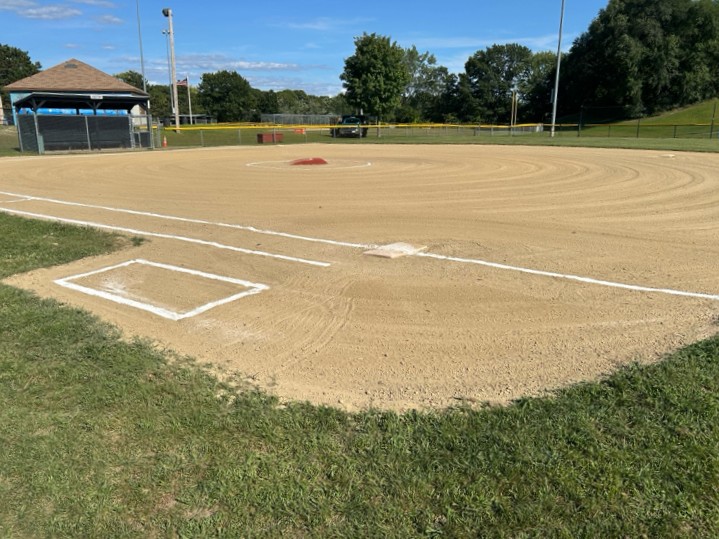 JT Owens Field 1 was converted to an all-clay infield to facilitate a growing Softball program. Looking across the diamond from 1st base shows a portable pitcher's mound added for baseball play