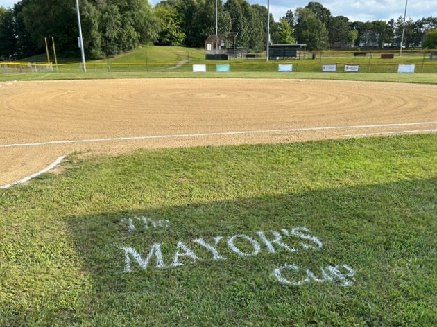 JT Owens Field 1 groomed and lined for 2026 Mayor's Cup facing the softball field from the 1b dugout