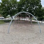 Major Park rope dome play structure for ages 5-12 viewed from atop the separate play structure for ages 2-5