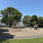 Major Park playground for ages 2-12 viewed from the berm on the Ellery St side of the park