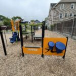 Mattie Smith Park play structure for ages 2-5 features bongos and junior overhead ladder and pullup bar