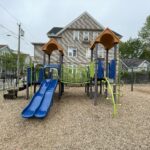 Mattie Smith Park play structure for ages 5-12 features double slide, bridge, two towers