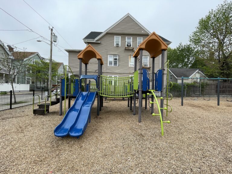 Mattie Smith Park play structure for ages 5-12 features double slide, bridge, two towers