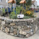 Mattie Smith Park corner stone planter with memorial
