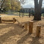 Miguel Luna Park log play structures creating using hardwood timber processed from a fallen tree at the park's basketball court