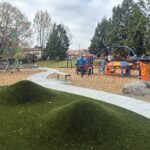 Miguel Luna Park playground synthetic turf moguls facing the tot play area for ages 2-5