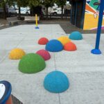 Miguel Luna Park rubber half spheres in the waterpark offer places to hang out