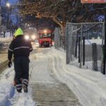 Miguel Luna Park parks crew removing snow from sidewalk on Sackett St Winter 2025-26