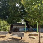Morris Ave Park features ample shade trees, bucket swings and benches