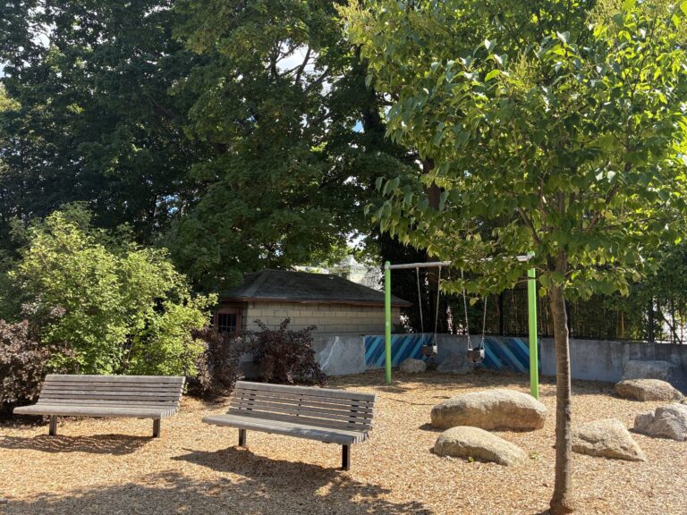 Morris Ave Park features ample shade trees, bucket swings and benches