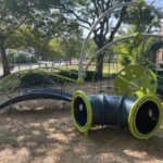 Mt Pleasant Little League Park play equipment includes a balance bridge and crawl tube for ages 2-5