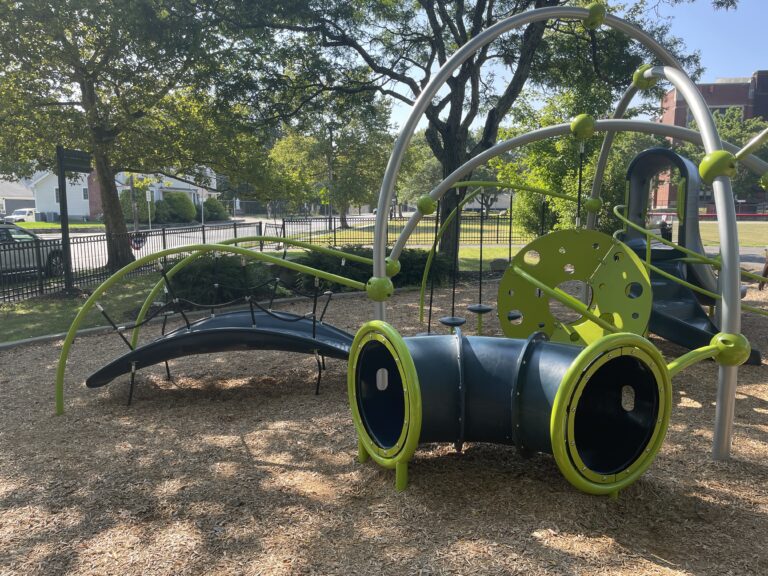Mt Pleasant Little League Park play equipment includes a balance bridge and crawl tube for ages 2-5