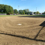 Mt Pleasant Little League Park field 3 view from behind the plate with batting cages visible behind left field
