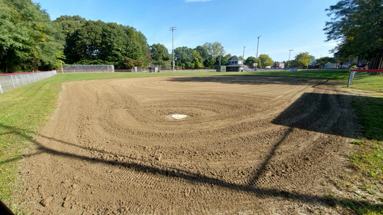 Mt Pleasant Little League Park field 3 view from behind the plate with batting cages visible behind left field