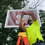 Ninth St Park maintenance replacing the basketball net