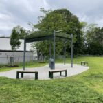 Obadiah Brown Interactive Misting Feature with shade and bench seating in 2025