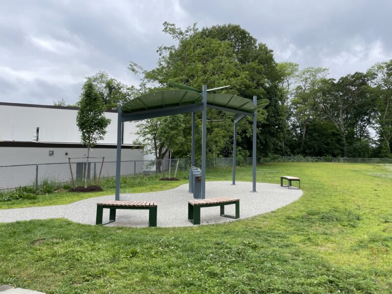 Obadiah Brown Interactive Misting Feature with shade and bench seating in 2025