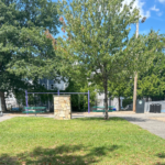 Pastore Park central green space between the basketball court and playground areas