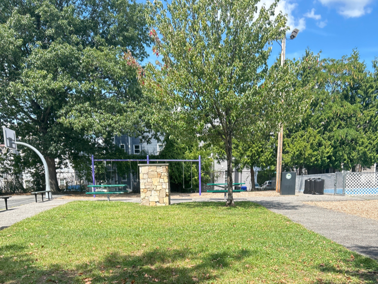 Pastore Park central green space between the basketball court and playground areas