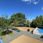 Pastore Park view of the park from atop the play structure for ages 5-12 with a tall slide