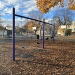 Pastore Park playground swings for ages 2-12 with fall leaves November 2025