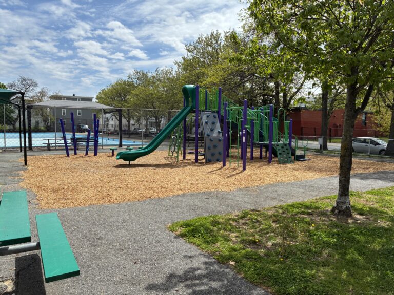 Pastore Park playground for ages 5-12 viewed from a picnic table in May 2026