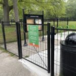 Paterson Park middle entrance on Paterson St features a community bulletin board and bike racks