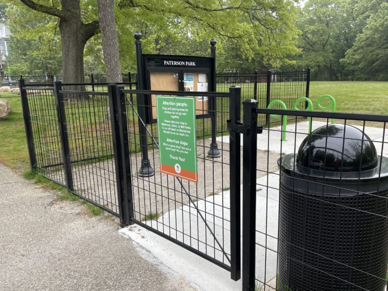 Paterson Park middle entrance on Paterson St features a community bulletin board and bike racks