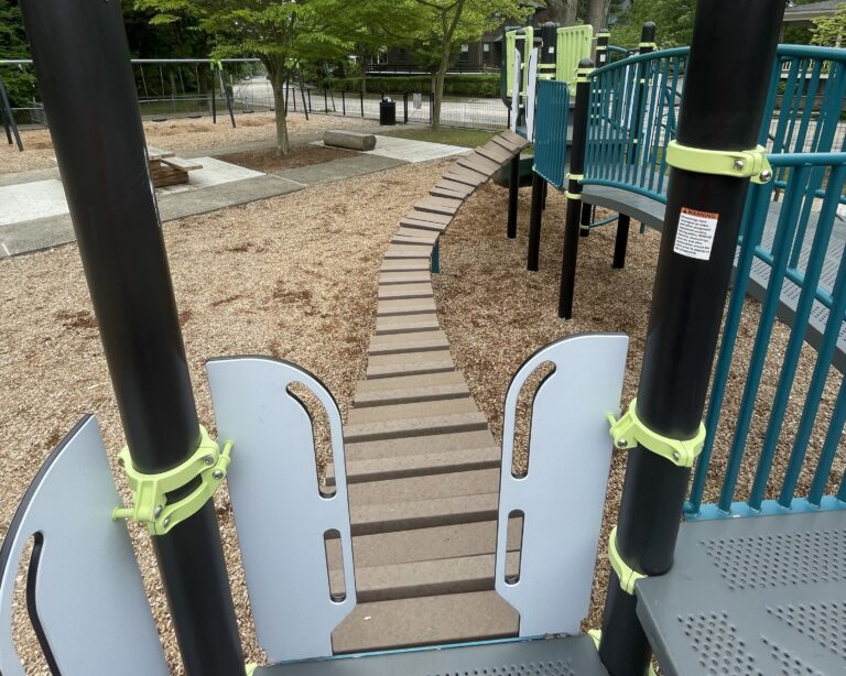 Paterson Park playground bridge viewed from inside the play structure for ages 5-12