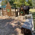 Paterson Park play houses, log steps, and sand play for ages 2-5