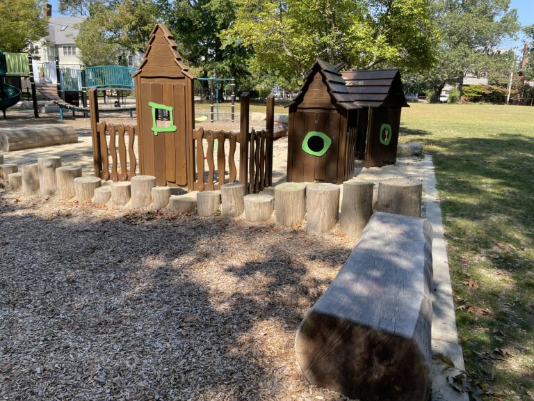 Paterson Park play houses, log steps, and sand play for ages 2-5