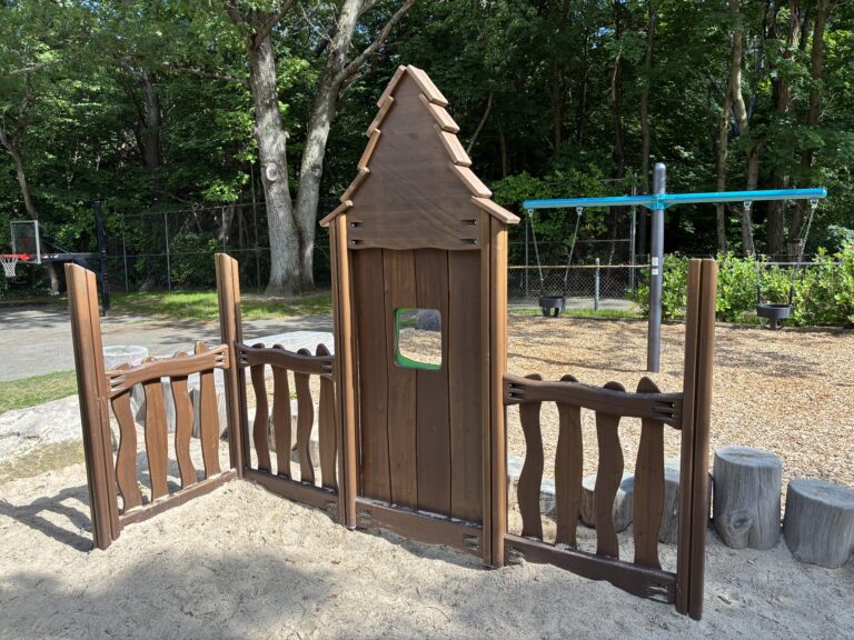 Paterson Park play houses and facades in a sand play area for ages 2-5