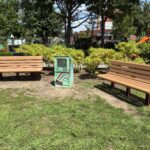 Peace & Plenty Park seating area with little free library