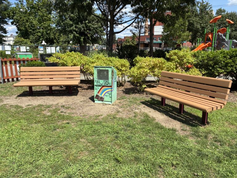 Peace & Plenty Park seating area with little free library