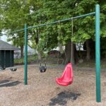 Pleasant St Park playground swings for ages 2-12