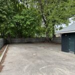 Pleasant St Park is the site of a former waterpark and contains a picnic table in the back