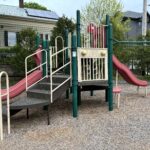 Pleasant St Park classic play structure for ages 2-12 is accessible via transfer stair and features two slides