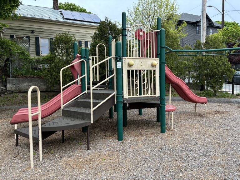 Pleasant St Park classic play structure for ages 2-12 is accessible via transfer stair and features two slides