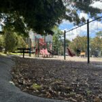 Pleasant St Park features playground swings for all ages including a bucket, molded ADA, and two belts