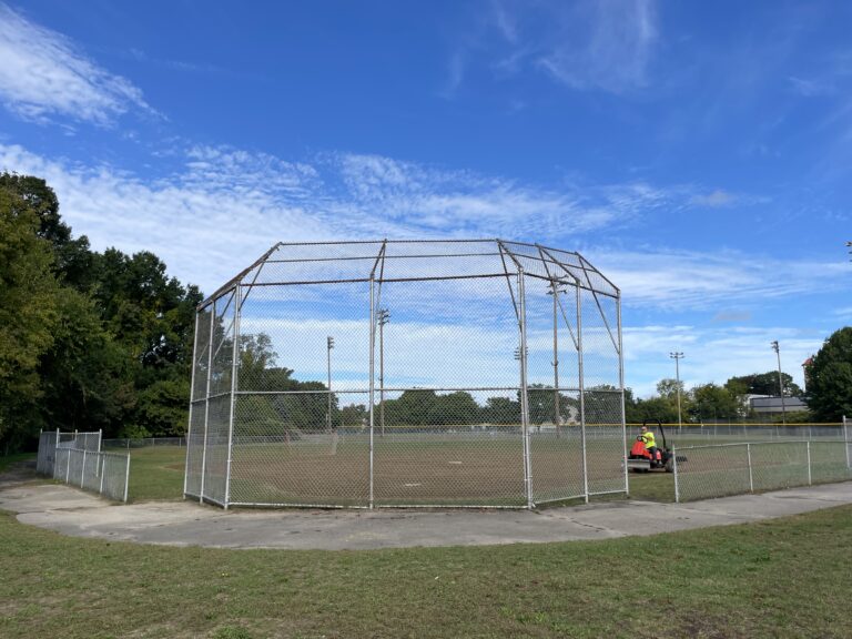 Prete-Metcalf Park field 3 being groomed for softball. Paved walking path connects all 3 fields and 2 playgrounds.