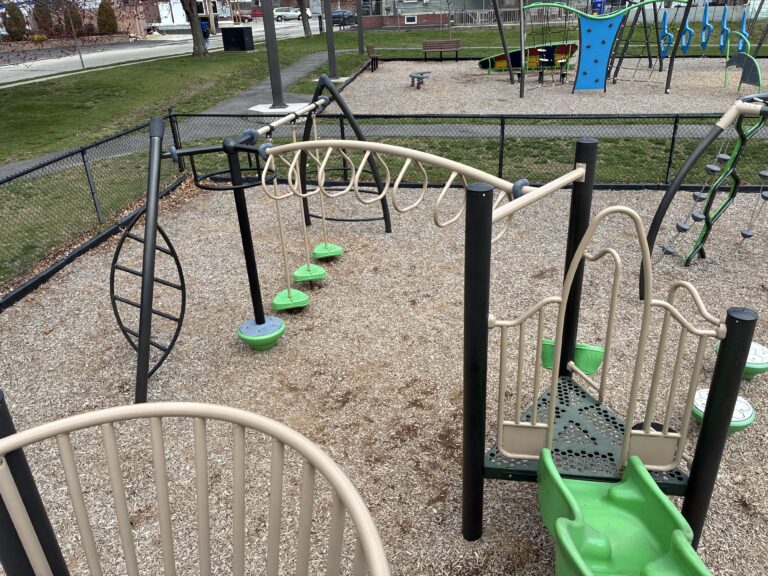Prete-Metcalf Park playground for ages 5-12 view of overhead loop ladder and other climbing features from the main structure