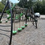Prete-Metcalf Park playground for ages 5-12 has an obstacle course layout leading to a traditional climbing structure with slides