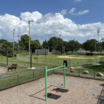 Prete-Metcalf Park features belt swings for ages 5-12, viewed from atop the playground structure