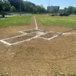 Prete-Metcalf Park Field 2 being groomed by Parks ballfield crew, view up the 3rd base line from home plate