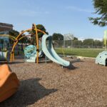 Richardson Park playground equipment for ages 2-5 including a slide with stair access